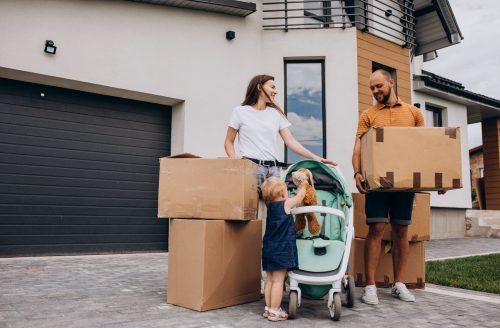 young-family-with-little-daughter-moving-into-new-house-scaled-e1607328786965