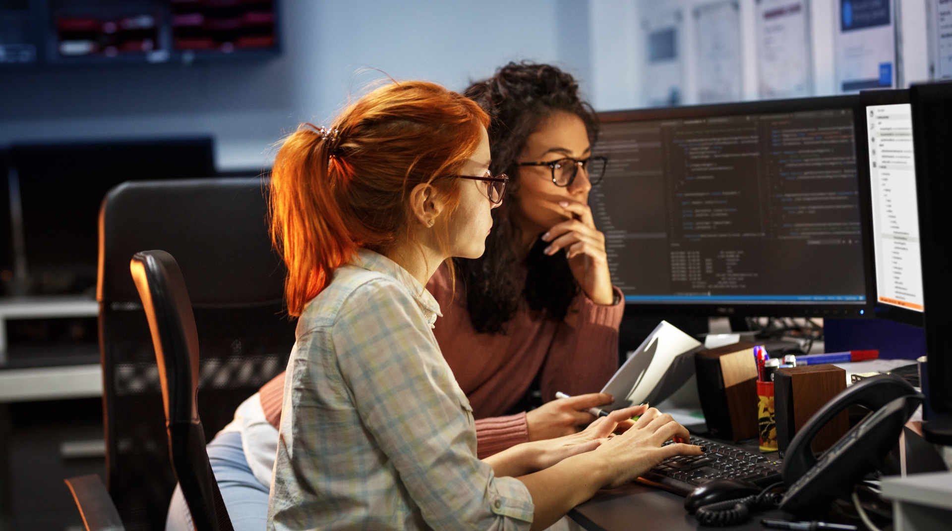 Professional woman analyzing financial data on a computer, assisted by GenAI-powered automation for accurate financial reporting.